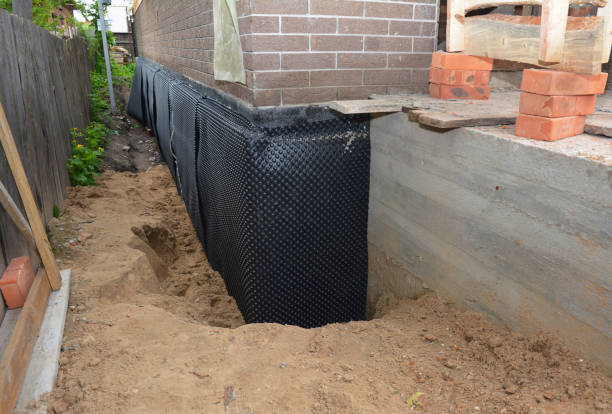SJ Waterproofing Pros technician performing targeted Waterproofing assessment in Phoenix, IL